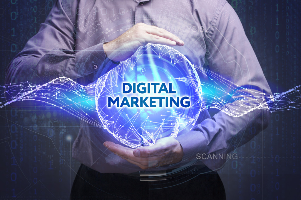 man holding a circular hologram with "digital marketing" written on it